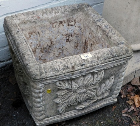 A reconstituted stone square garden planter, with fluted and floral decoration, 34cm high, the top 40cm x 40cm.