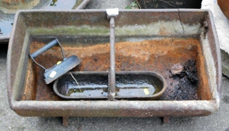 A wrought iron animal feeder, 30cm high, 63cm wide, 34cm deep, a smaller trough, 37cm wide, 12cm deep, and a metal iron. (3)