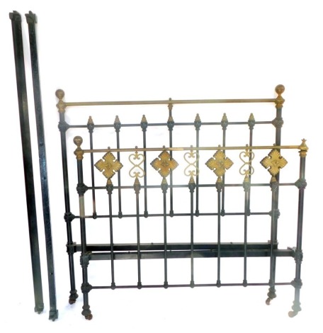 A Victorian cast iron and brass double bed, with side irons, and a pine slatted mattress shelf.