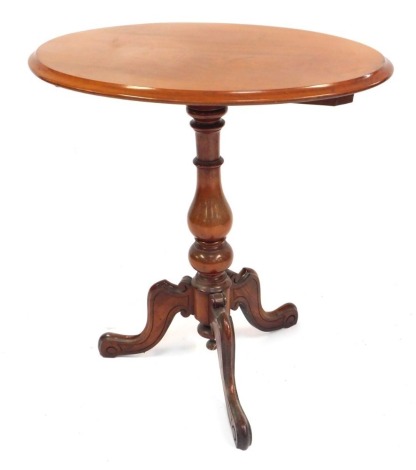 A Victorian mahogany tilt top occasional table, raised on a baluster turned column, over three cabriole legs, 70cm high, the top 67cm x 48cm.