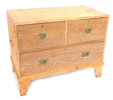 A limed oak and pine military chest, with pair of brass carrying handles, having two deep and one long drawer, raised on bracket feet, 76cm high, 100cm wide, 54cm deep.