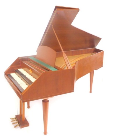 A 1960s William de Blaise teak cased harpsichord, with rosewood and white plastic keys, with tuning key, brochure, and maintenance manual.