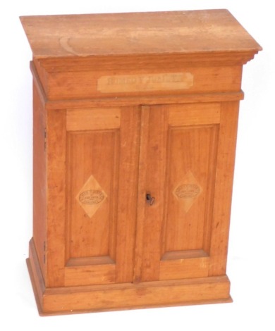 An early 20thC oak shop cigar cabinet for Romeo Y Julieta Habana Cigars, 61cm high, 45.5cm wide, 26.5cm deep.