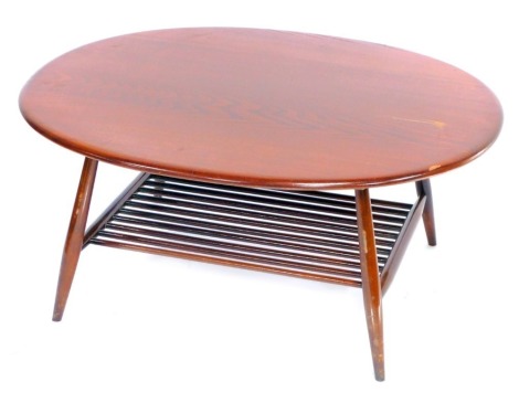 A G-Plan dark elm coffee table, the oval top raised on turned legs untied by a rod slatted under tier, 44cm high, 94cm wide, 83cm deep.