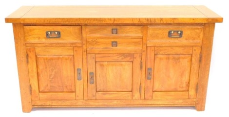 A mango wood sideboard, two central drawers over a coloured door, flanked by two further drawers over cupboard doors, raised on stiles, 85cm high, 168cm wide, 50cm deep.