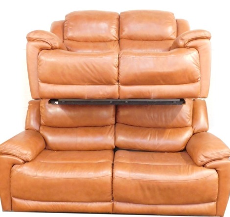 A tan leather sofa suite, comprising three seater and two seater sofa, each with manual recliners, the three seater 210cm wide, 95cm deep, 102cm high, the two seater 159cm wide, 95cm deep, 102cm high.