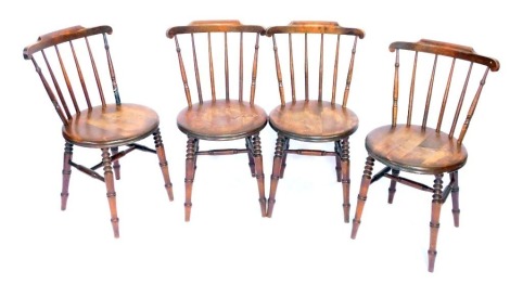 A set of four 20thC Continental beech kitchen chairs.