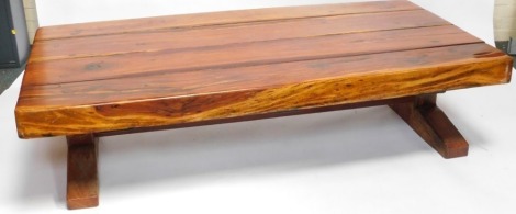 A solid oak rectangular coffee table, with four panel top, 44cm high, 180cm wide, 90cm deep.