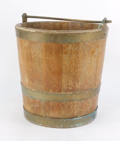 An oak and brass bound bucket, with swing handle, 30cm high, 28cm diameter.