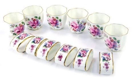 A group of Royal Crown Derby egg cups and napkin rings, each in the Derby Posies pattern, with green Royal Crown Derby stamp. (12)