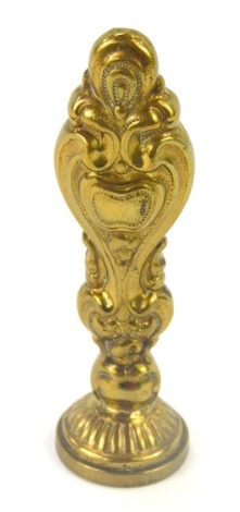 A 19thC style gilt brass seal, with a circular stamp bearing the initial W, the seal 18mm wide, 6.5cm high.