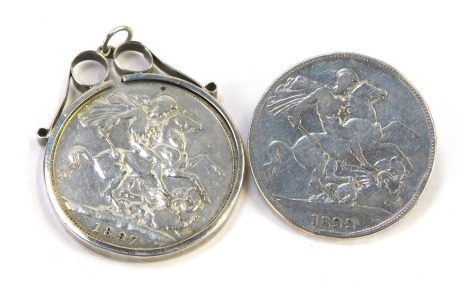 A Victorian silver crown, dated 1897, in a pendant mount, and a George IV silver crown, dated 1822, with applied silver pin back, 60.6g all in. (2)