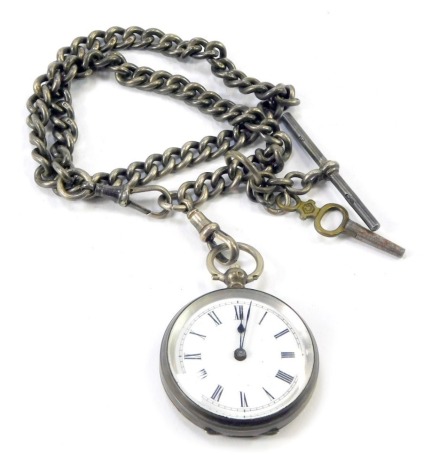 A Victorian silver lady's pocket watch, with engraved shield and flower engraved case, with white enamel Roman numeric dial, 3.5cm wide, on a silver curb link watch chain with T bar, 40cm long, 85.2g all in.