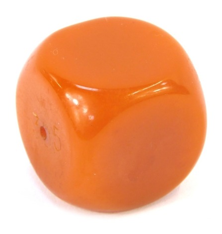 An African amber cube bead, with pierced centre and rounded edges, 3cm x 3cm, 30.6g all in.