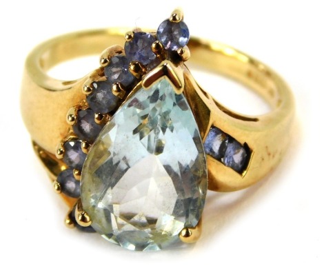 A 9ct gold aquamarine and amethyst dress ring, with teardrop shaped aquamarine surrounded by amethysts, ring size N½, 4.5g all in.