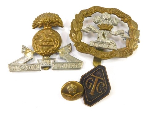 A group of military related cap badges, comprising an Egypt Lancashire Fusiliers cap badge, a South Lancashire Fusiiers Prince of Wales Volts badge, a military button, and a GTC pin badge. (4)