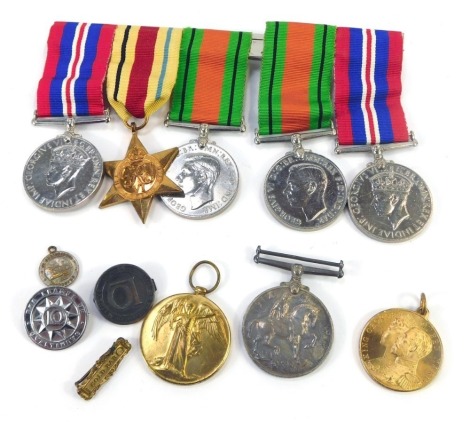 WWI and WWII medals, comprising Great War and Victory medals, named to Pte C W Rawden, Lincolnshire Regiment, No 2277, 1939 and Defence medals and Africa Star, further medals, pin badges, etc. (a quantity)