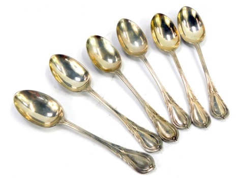 A set of six Edward VII table spoons, each with a moulded leaf design top, Mayfair MW Bros London 1902, 10.96oz.