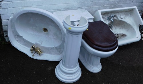 Bathroom pieces, comprising sink and pedestal, toilet, and additional sink.