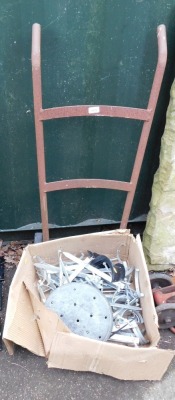 A metal sack barrow and various metal spikes. (1 trolley and 1 box)