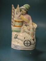 A Staffordshire figure of a Scottish lad leaning on his drum with a canon to base