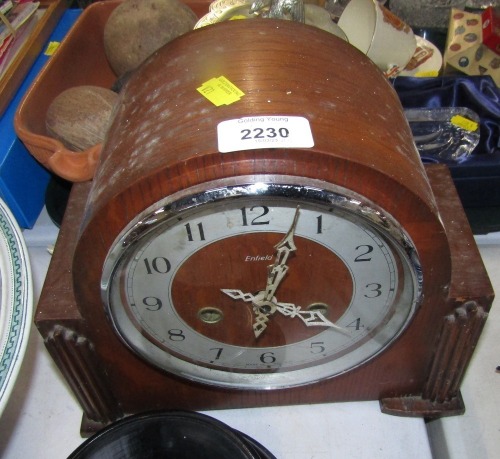 An Enfield oak cased mantel clock.