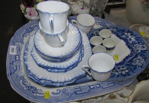 A Victoria blue striped part tea service, blue and white egg cups, and a large meat plate.