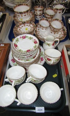 Two part tea services, comprising a cream and pink rose part service, and a Staffordshire china part service. (2 trays)