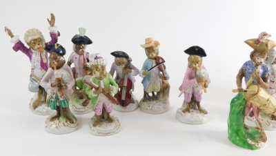 A comprehensive continental harlequin porcelain monkey band, to include conductor, in yellow jacket with arms raised, 21cm high, French horn player, violinist, further conductor and other various pieces, pottery monkey band drummer, various others, some w - 2