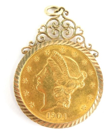 A 1904 double gold eagle United States of America twenty dollar coin, in an elaborate 9ct gold scroll mount, 6cm high, 39.2g all in.