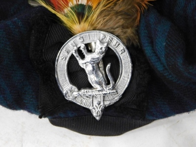 A Black Watch Tartan kilt, with sash, scarf, tie, and socks, all in Black Watch Tartan, sizes unknown, and an associated sporran, with Gordon Highlander's Crest, probably late edition and all non Army issue. (a quantity) - 3