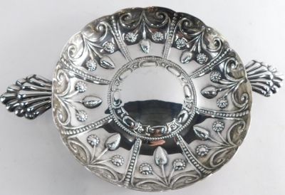 An Edward VII silver dish, by Wakeley and Wheeler, repousse decorated with panels of flowers, with a raised centre and elaborate handles, London 1903, 35cm wide, 20.4oz. - 3