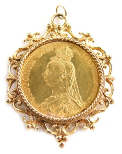 A Victorian gold jubilee five pound coin, 1887, in elaborate 9ct gold scroll mount, with plain circular ring top, 6cm high, 49.4g all in.