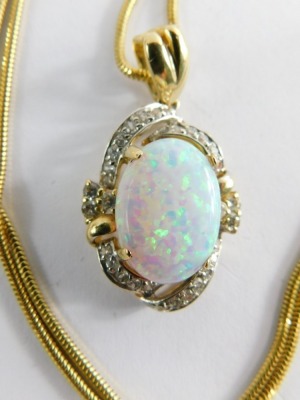 An opal and diamond pendant, the oval opal surrounded by twist design of tiny diamonds, in a raised basket setting, yellow metal unmarked, with Byzantine link neck chain stamped 585, the pendant 3cm high, the chain 42cm long, 8.7g all in. - 2