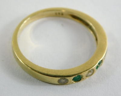 An emerald and diamond half hoop dress ring, set with three emeralds and four diamonds, each in an illusion setting, yellow metal unmarked, ring size O, 2.7g all in. - 4