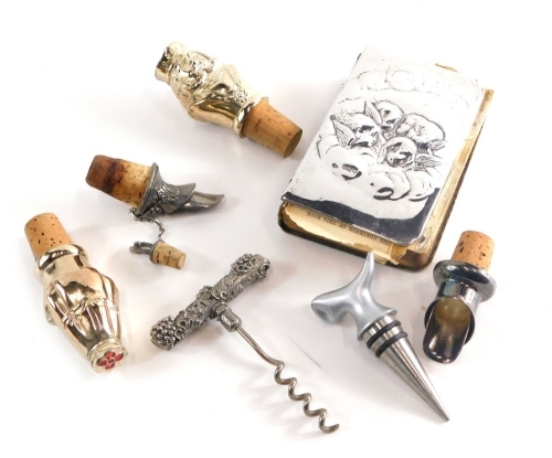 Various silver and related effects, a silver fronted Bible by William Comyns and Sons, repousse decorated with angels and clouds, London 1913, various silver plated cork stoppers, bottle pourers, corkscrew, etc. (a quantity)