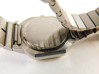 A Longines ladies wristwatch, with an octagonal watch head, on a white Roman numeric dial with date aperture, with gold coloured screw in bezel, on a stainless steel bracelet, the watch head 2cm x 2.5cm, the strap stamped stainless steel, 43g all in. - 4