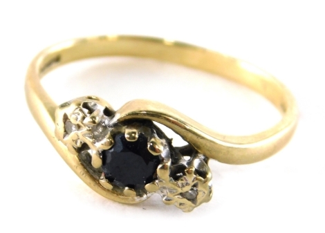 A 9ct gold sapphire and diamond twist ring, set with round brilliant cut sapphire, flanked by two illusion set tiny diamonds, on twist design band, ring size M½, 2g all in.