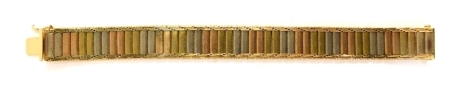 A tricolour costume jewellery, plated and unmarked bracelet, of brushed design, with copper and silver colouring, unmarked, 21cm long.