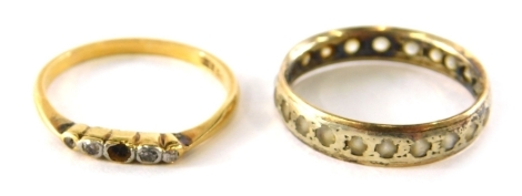 Two dress rings, comprising of an 18ct gold five stoned diamond dress ring, stones missing, ring size P and a 9ct gold and silver eternity ring set with cz stones, ring size Q½, 4.6g all in. (2)