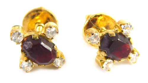 A pair of paste stone set screw in earrings, each set with a red and white paste stone, on screw in back, with gold coloured border but plated, boxed.