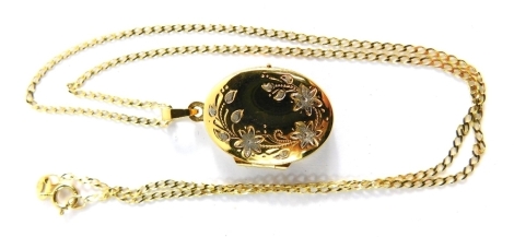 A 9ct gold oval locket, engraved with flowers and leaves, 2cm high, on a fine link necklace, 40cm long, 3.6g.