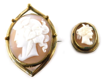 An oval cameo brooch, lady quarter profile in shaped surround unmarked, 5cm high and another cameo pendant. (2)