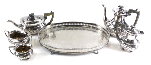 A 20thC silver plated part tea and coffee service, comprising of coffee pot, tea pot, two handed sugar bowl, water jug and milk jug on a gallery edged tray, 41cm wide.