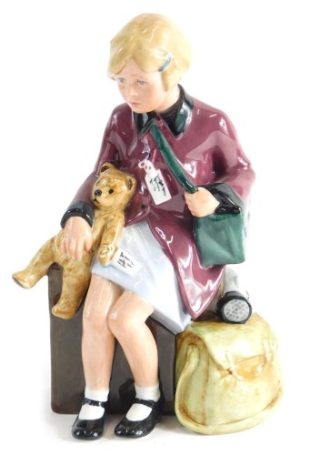 A Royal Doulton limited edition figure Girl Evacuee, number 7016 of 9,500, unboxed and lacking certificate, 17cm high.