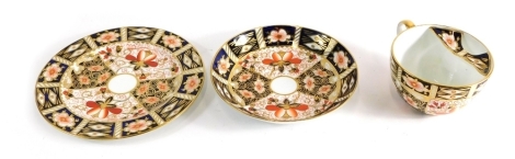 A Royal Crown Derby Imari pattern moustache cup trio, comprising cup, saucer and side plate, 17cm diameter, marked beneath. (3)