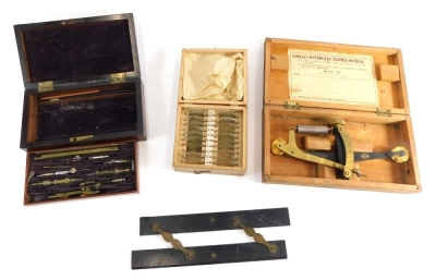 Various optician aids, spectacle lenses, an RAF tautness meter, partially cased, and a mahogany bone handled part geometry set.