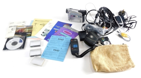 A Canon MV 600I digital camera, with various accessories, camcorder, charger, some partially boxed, the box 26cms wide.