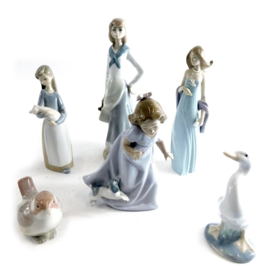 A Lladro figure group of a child holding piglet, 19cm high, and various other Lladro, Nao and other similar figures, various marks beneath. (a quantity)