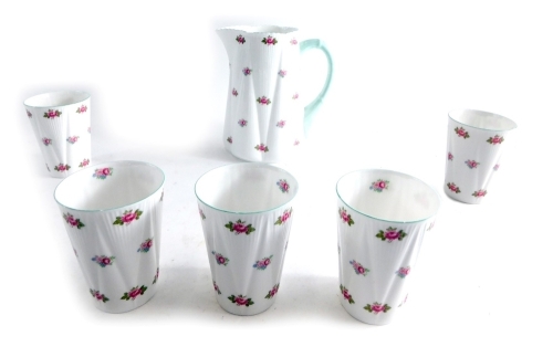 A Shelley Rosebud part drinks set, to include lemonade jug number 13426, decorated with flowers, 21cm high, and five beakers. (6)